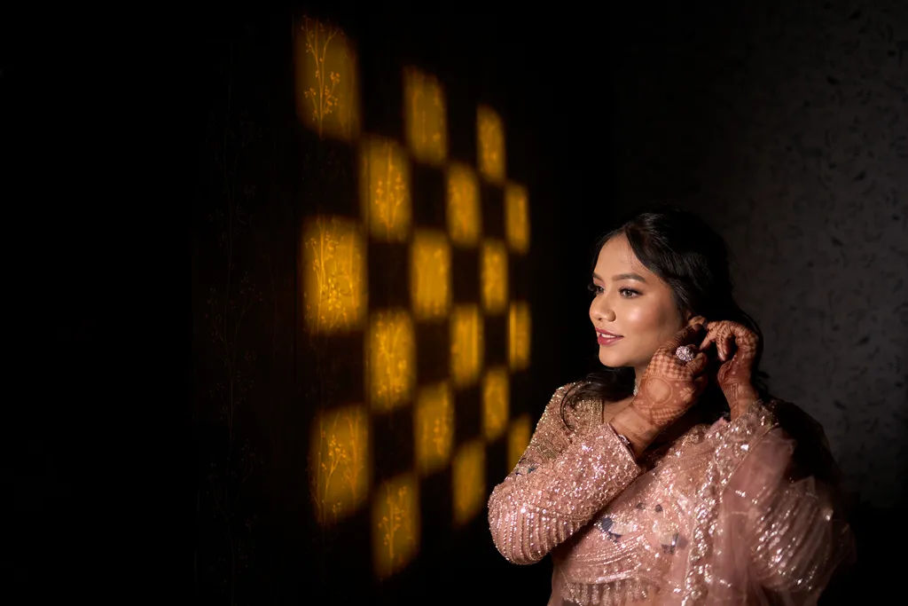 Bride pose with checkerboard gobo pattern light at an engagement photoshoot in Varanasi by The WeddingShoot